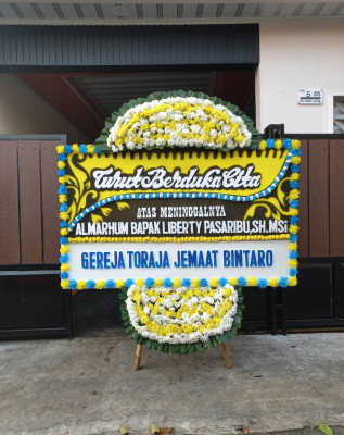 Papan Bunga Duka di Raya
