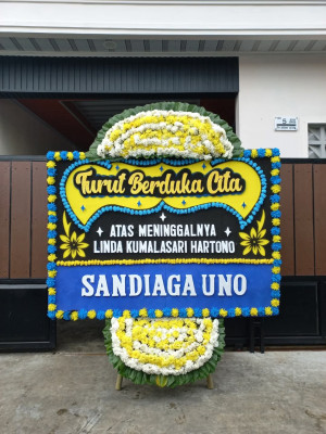 Papan Bunga Duka di Raya